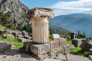 Delphi, Greece, November 19, 2019: Part of column in Ionic style in Apollo's Sanctuary
