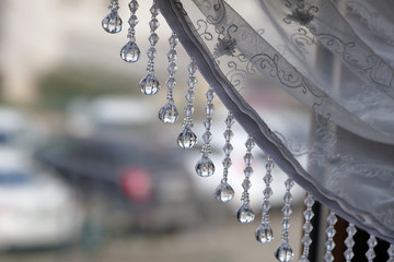 curtain decoration beads and outside view from the window,