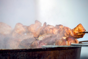 cooking barbecue on the street. meat food. quick snack