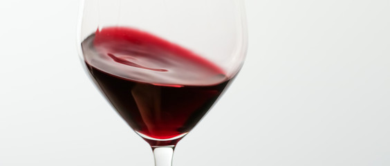 Glass of red wine, pouring drink at luxury holiday tasting event, quality control splashing liquid...