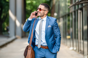 Young businessman talking on his phone