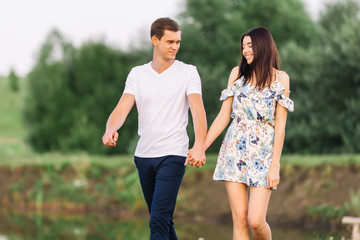 young couple walking in the park