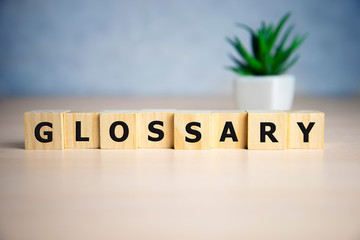 Glossary word made of square letter word on blue background - obrazy, fototapety, plakaty