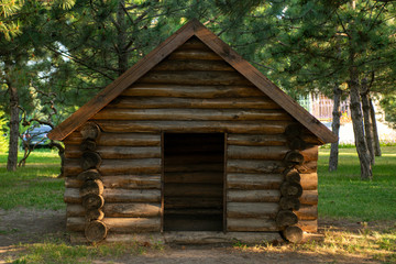 Wooden house. Children's play wooden house. A model of a wooden rural small house