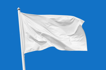 White flag waving in the wind on flagpole, isolated on blue background, closeup - obrazy, fototapety, plakaty