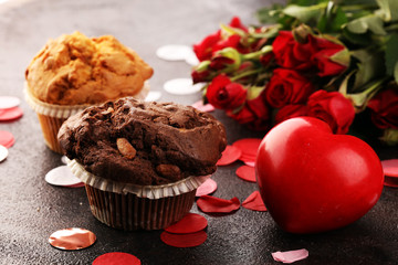 chocolate muffins, blueberry muffin and nut muffins on dark background for Valentine's day. tinting. selective focus
