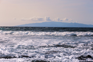 Fototapeta na wymiar ocean and island in the distance