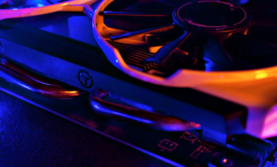 Graphics card in neon light. Cooling in a computer. Fan blade © Сергей Опиканец