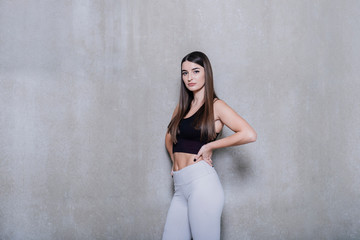 Fototapeta premium attractive fitness woman, trained female body, lifestyle portrait, caucasian model