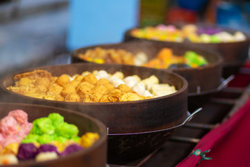 Colorful steamed dim sum, chinese dumpling in a wooden steamer. at Jalan Alor night market, Kuala...