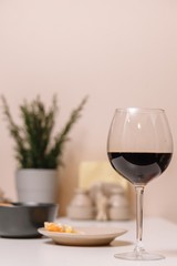 Glass of red wine on the kitchen table