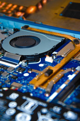The inside of the laptop. Central processor, cooler, pc cooling tubes. The main key elements of a laptop in macro