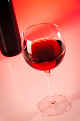 Wine glass with red background