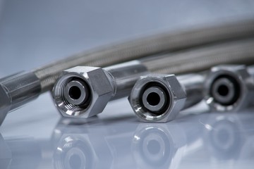 Stainless steel pressure hose with screw connection.