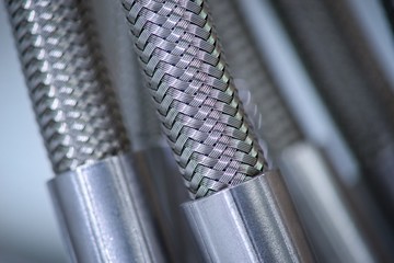 Stainless steel pressure hose with screw connection.