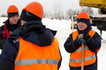 Workers at the assembly site of the ice town