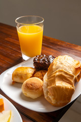 Orange Juice, Chocolate cake, Brazilian Snacks, Cheese bread, Eggs mixed