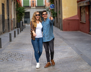 Young couple in love walking on the street on romantic trip