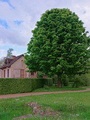 Rustic house of Marie Antoinette at the Palace of Versailles in Paris in France.
