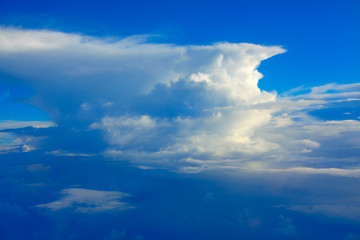 summer cumulus clouds on blue background