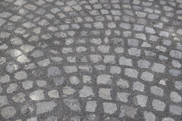 A typical Italian pavement: Sampietrini (or Sanpietrini). Black and white.