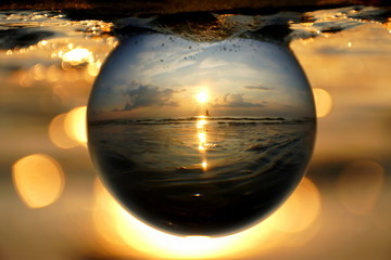 Beautiful sunset captured through a glass lens ball at Cape Henlopen State Park, Lewes, Delaware, U.S.A © Khairil