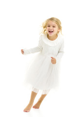 Charming little girl laughing happily in studio