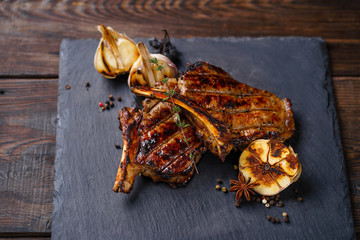 grill and barbeque, restaurant menu, tomahawk rib steak served on slate, traditional american...