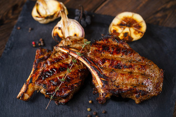 juicy rib steak served on slate, traditional american cuisine,grill and barbeque, meat restaurant menu