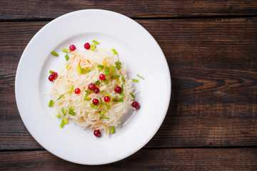 Pickled cabbage with carrots and cranberries. Preserved food, tasty snack, fermented product