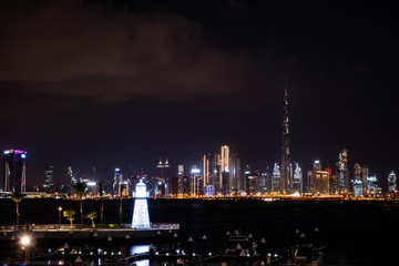 Fototapeta na wymiar Dubai city at night with Burj Khalifa as the highest building