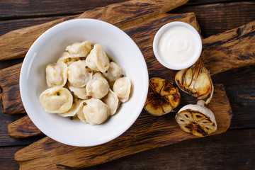 Tasty dumplings with meat, pierogi, homemade meals. Ukrainian, Russian cuisine. Nourishing and delicious national food, ethnic restaurant menu
