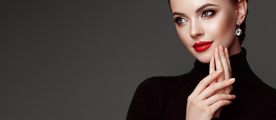 Beautiful Young Woman with Clean Fresh Skin. Perfect Makeup. Beauty Fashion. Red Lips. Cosmetic Eyeshadow. Girl in Black Turtleneck - obrazy, fototapety, plakaty