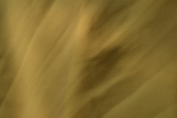 The surface of the fabric is light and bright with sunlight falling.