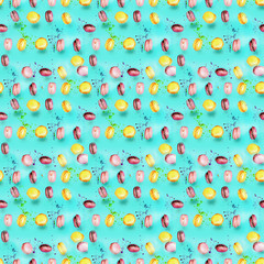 Abstract seamless pattern with flying colored macaroons, holiday concept.