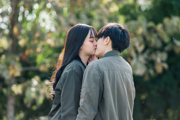Obraz premium A couple of gay woman holding hands each other and kissing. Moments Happiness Concept
