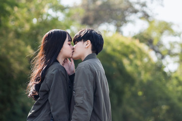 Fototapeta premium A couple of gay woman holding hands each other and kissing. Moments Happiness Concept