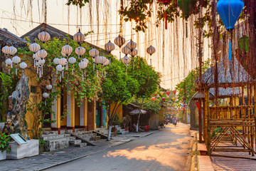 Awesome view of cozy street decorated with silk lanterns
