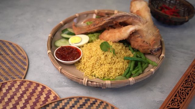 turmeric rice or nasi kunyit popular asian food with fish