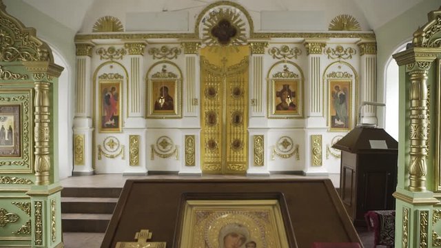 Orthodox golden cross and icon in the church.