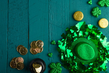 St. Patrick's Day celebration, on green wooden background, top view