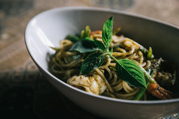 Pesto Spaghetti with shimp in high contrast italian food