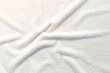 White towel texture for background. That fabric or textile consist of cotton fiber material. Look plush, fluffy, dry, soft and clean. For background about baby, spa, hotel, laundry and hygiene etc.