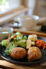 Beef Croquette with rice and salad japanese style Korokke on wooden