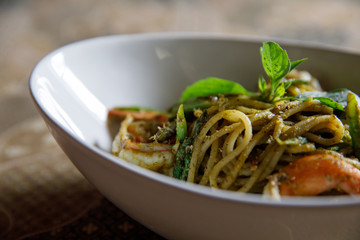 Pesto Spaghetti with shimp in high contrast italian food
