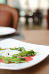 Beef Carpaccio cold appetizer with parmesan cheese italian food