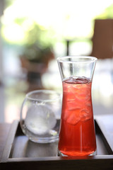 Strawberry iced tea on wood background