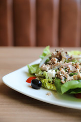 Tuna salad appetizer on wood background