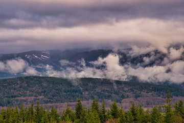 The SNOQUALMIE VALLEY NEAR NORTH BEND WASHINGTON WITH CLOUDS MOVING IN