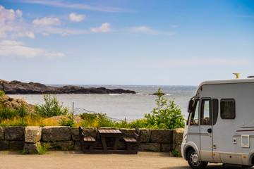 Camper car on coast of Norway with ocean view
